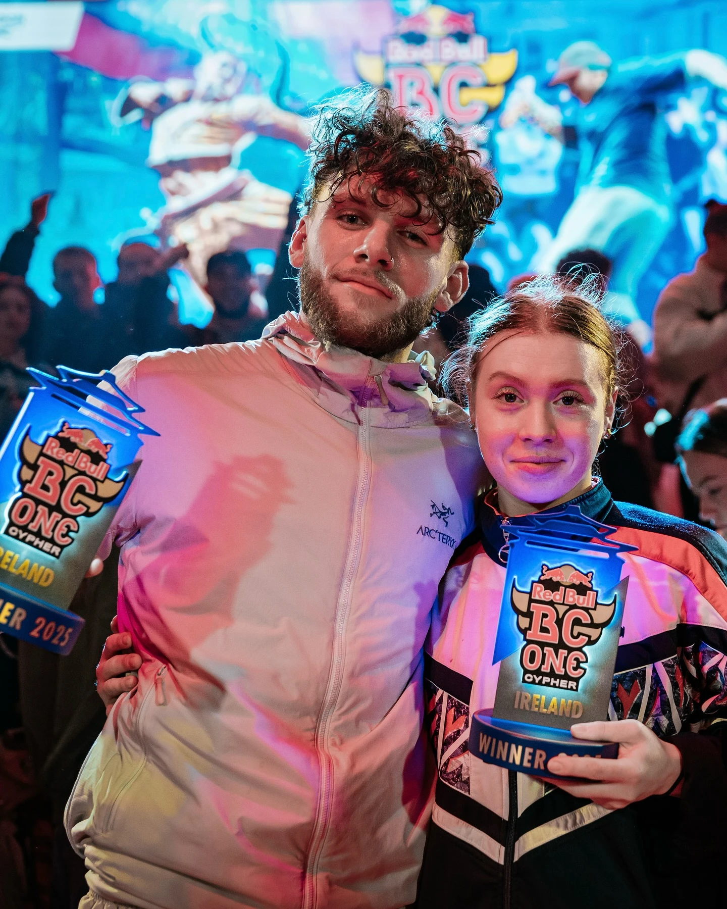 Tara holding her Irish Red Bull BC One Cypher trophy alongside a fellow winner