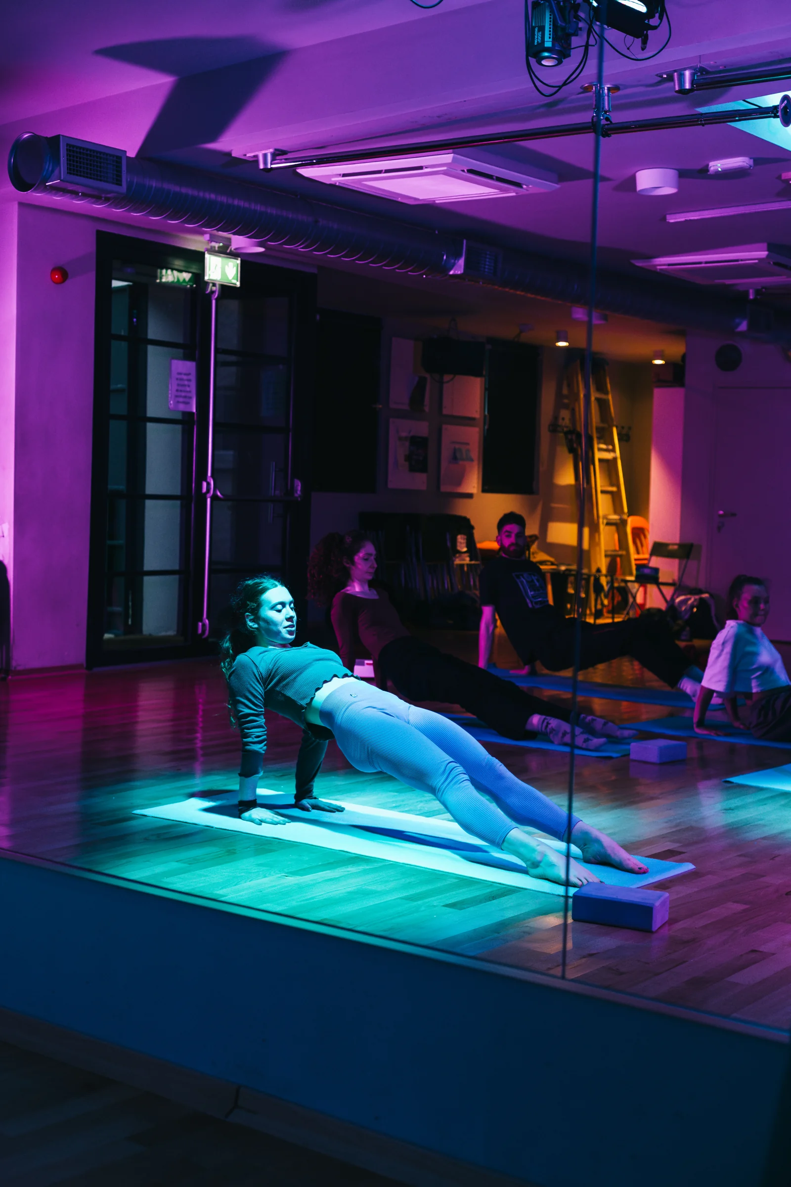 A participant extending through a reverse tabletop movement